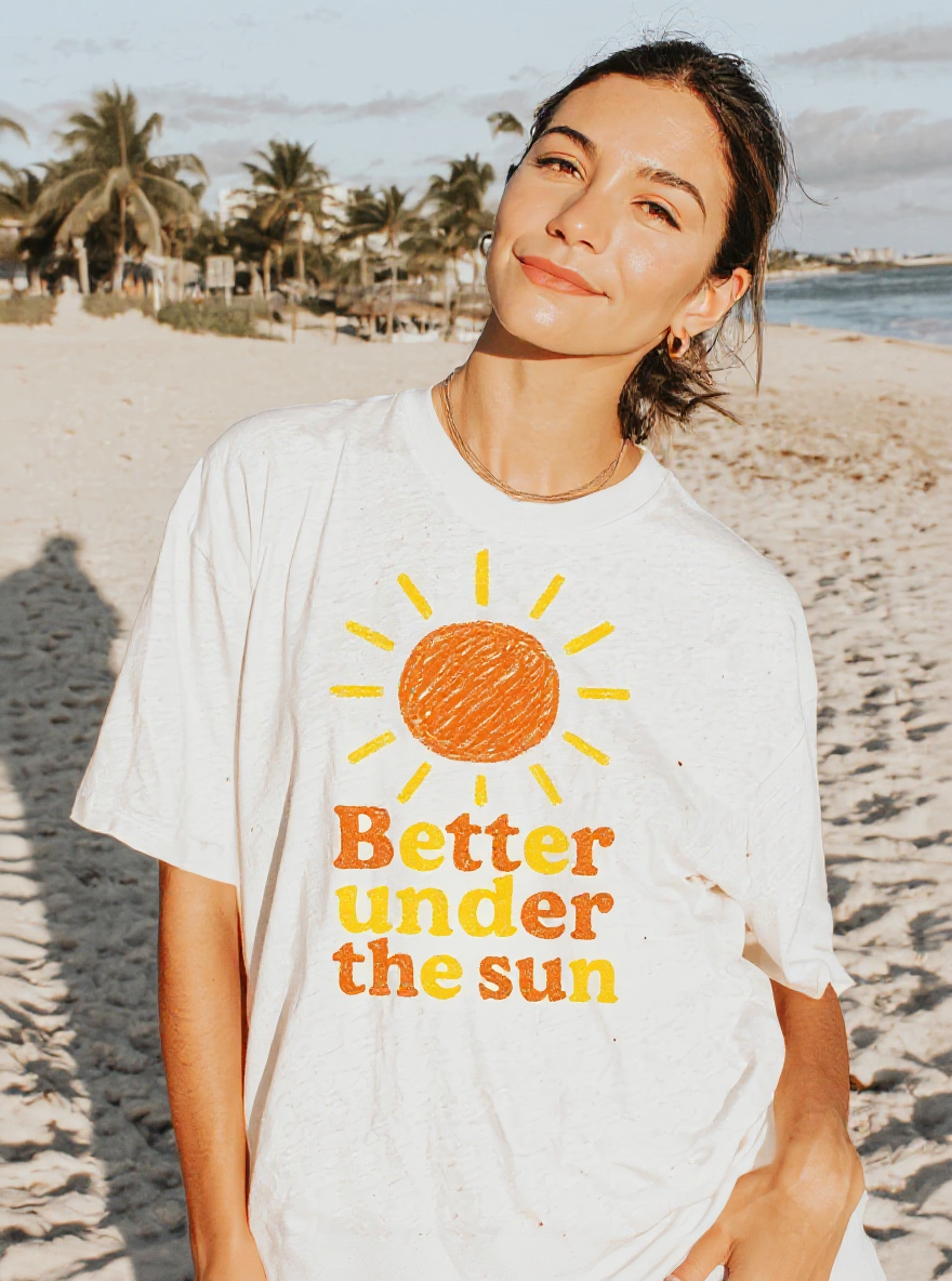 Better Under the Sun T-Shirt - assets-task_01k0mqs5nzf63bf8rkzjq5y9zy-1753042855_img_0-on-model-1-flux-2025-07-21T20-08-08-478Z.png
