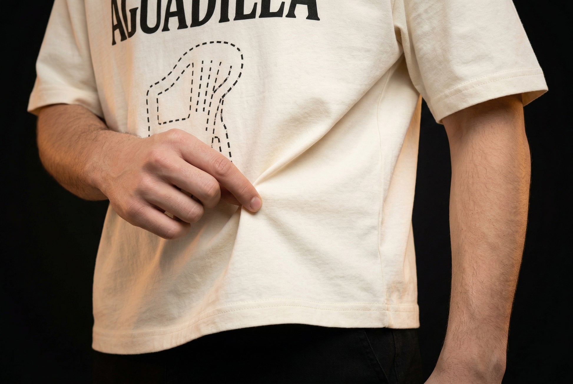 AGUADILLA Chair T-Shirt - El que se va pa' Aguadila pierde su silla — aguadilla-chair-t-shirt-el-que-studio-05-hem-hand