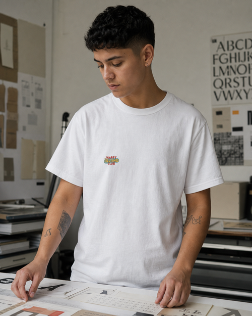 Puerto Rican adult wearing Algaro Tee with Red Chevron in a relaxed creative setting