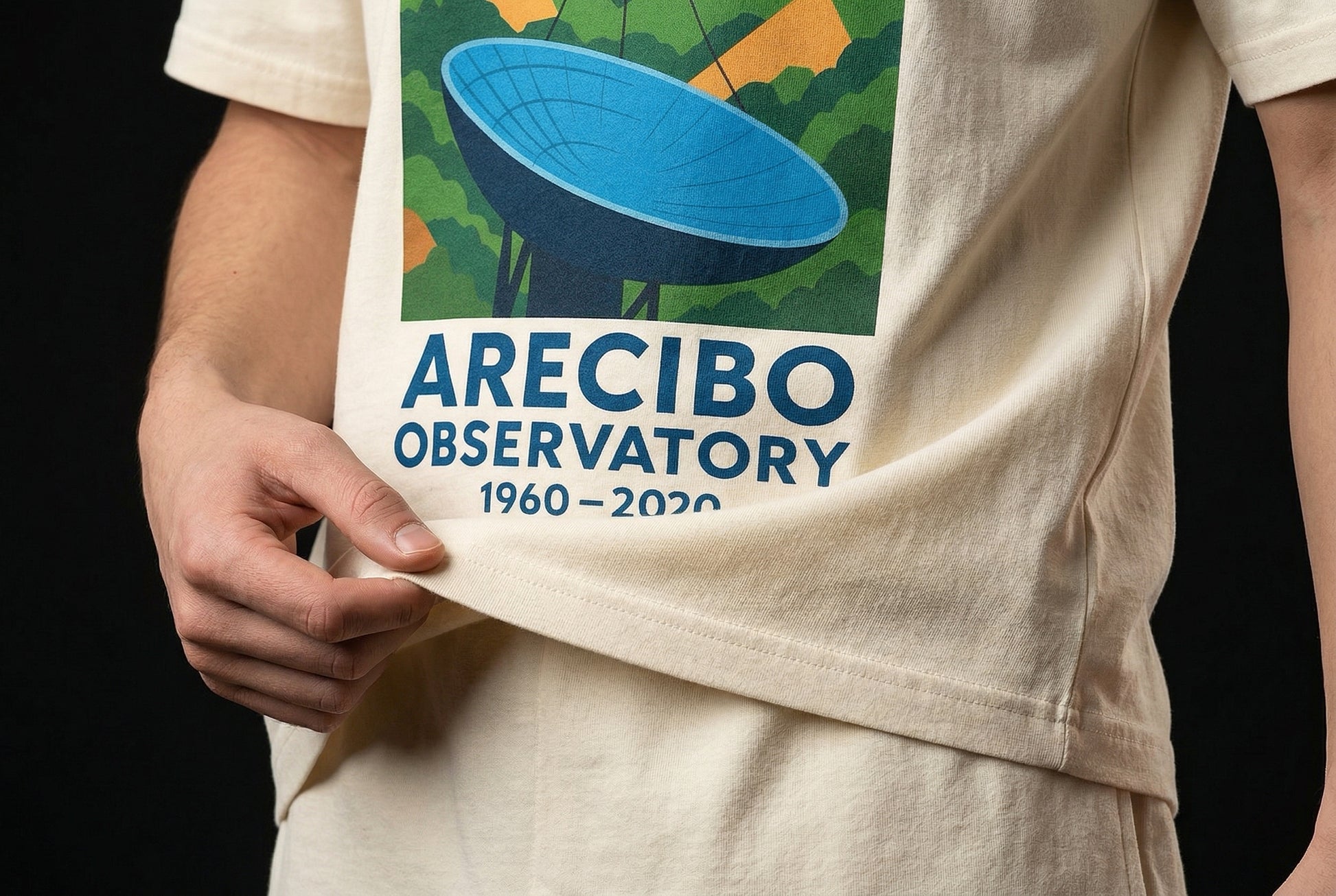ARECIBO OBSERVATORY 1960–2020 T-Shirt — arecibo-observatory-1960-2020--studio-05-hem-hand