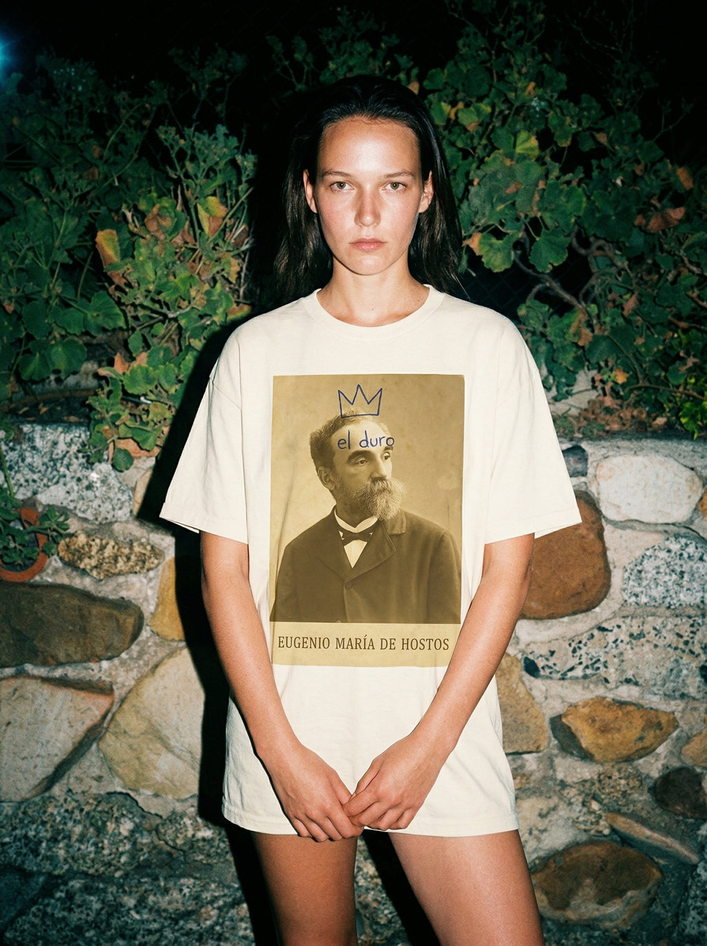 El Duro - Eugenio María de Hostos T-Shirt — el-duro-eugenio-mar-a-de-hosto-lifestyle-b-stone-wall-night-flash