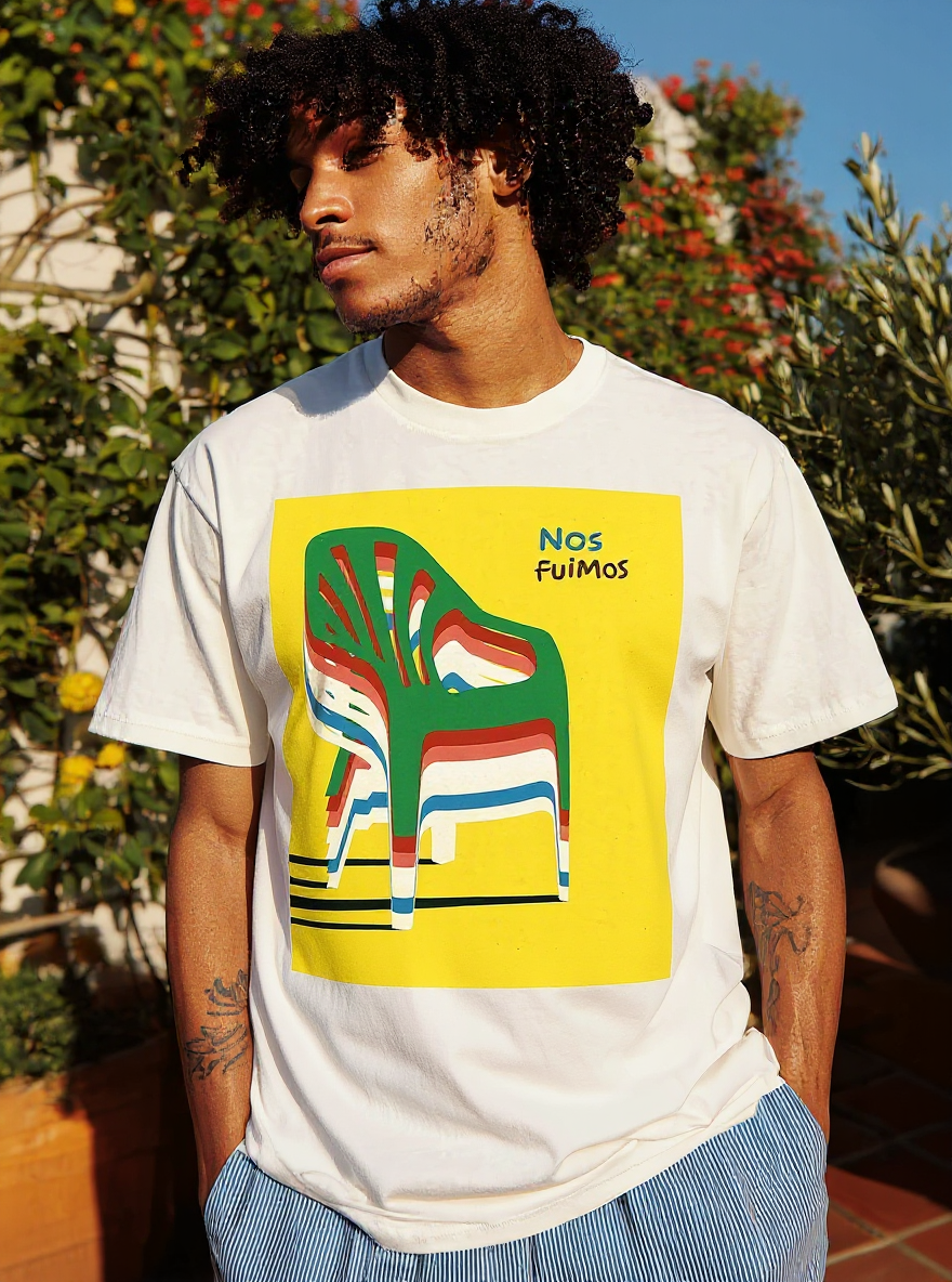 Nos Fuimos Colorful Chair T-Shirt - assets-task_01k0mprdm3f5bvj2s82a2qh25d-1753041778_img_0-on-model-1-flux-2025-07-21T20-06-28-170Z.png