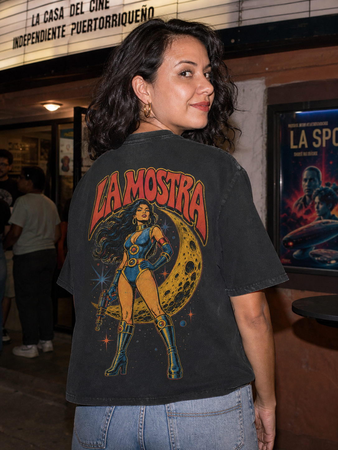 Woman wearing the La Mostra back-print T-shirt outside a Puerto Rican cinema
