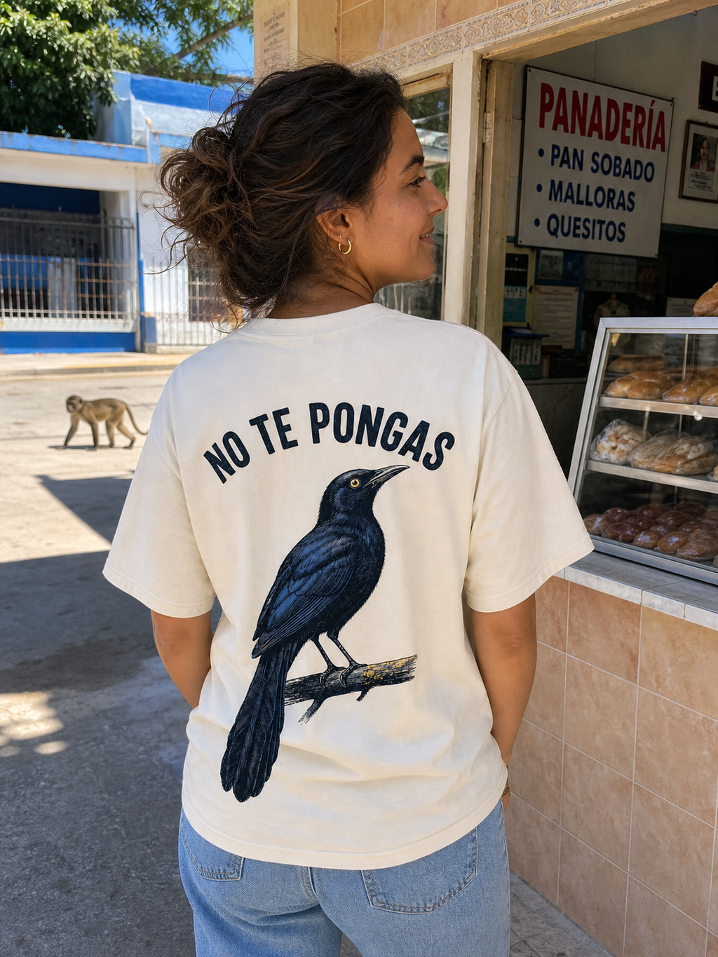 Woman wearing the No Te Pongas Chango back print in Puerto Rico