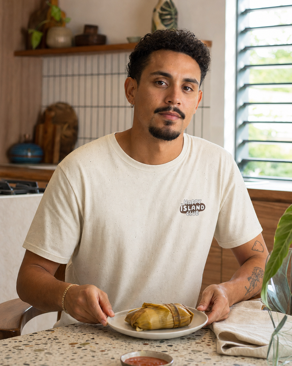 Puerto Rican adult wearing Team Pasteles Con Ketchup in a relaxed creative setting